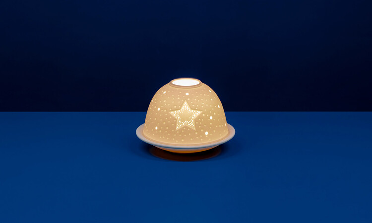 Twinkling Star Tealight litho-phane made from unglazed white porcelain featuring a beautiful star design.